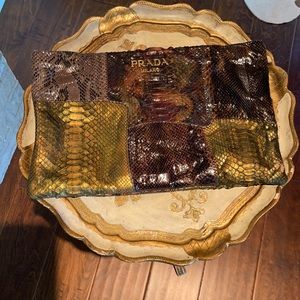 Prada snakeskin clutch. Strap for hand. Multi hues and colors